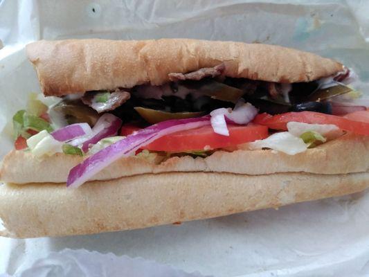 Classic steak and cheese with lettuce, tomato, red onion, black olives and jalapeno.