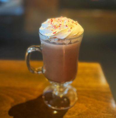 Warm up by our fireplace with our Peppermint Patty winter cocktail! Warm hot chocolate with peppermint Schnapps topped with whipped cream.