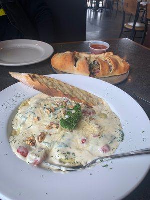 Mushroom Ravioli. So creamy with lots of spinach and fresh tomato.