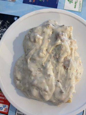 A single Homemade Biscuit & Sausage Gravy