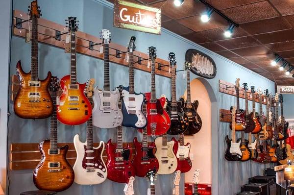 Gretsch, Fender, ESP, Gibson, Danelectro, Duesenberg, and many other lines can be found on our electric wall!