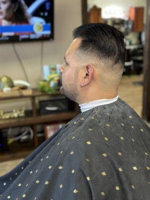 Mid skin fade with scissor trim haircut. Barbershop in Ventura