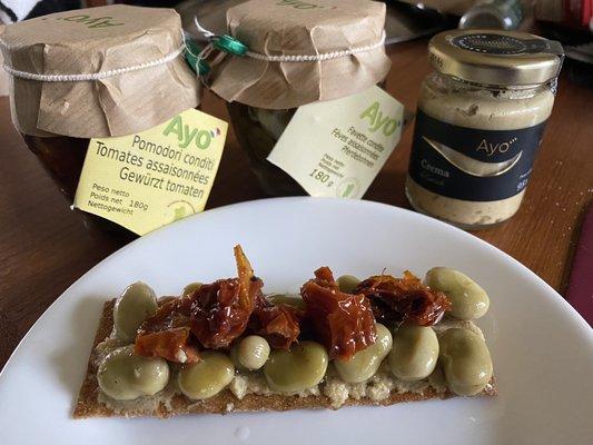 Ayo products from Madeleine's lovely market.  A cracker top with marinated sun dried tomatoes and lima beans on top of artichoke cream.