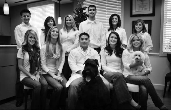 Dr Won (in the middle with his dog) and staff