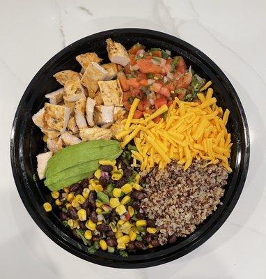 Quinoa Burrito Bowl: fresh pico de Gallo, quinoa, grilled chicken, sliced avocado, shredded cheese and homemade black bean & corn salsa.