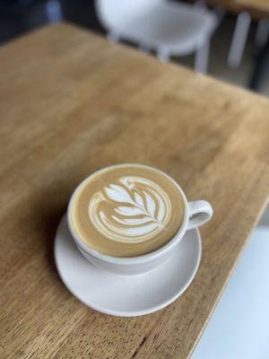 lovely latte art for a classic whole milk latte