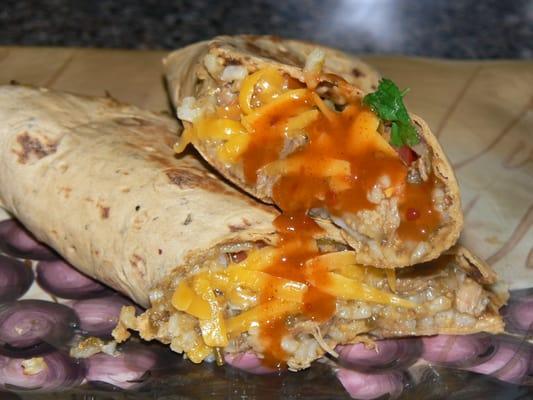 Green Chili Pork with Cilantro Lime Rice, Onion, Cheddar Cheese, Tomato, Cilantro, Pico Pica Hot Sauce, Whole Wheat Tortilla.