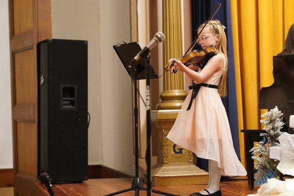 Violin Lessons at Encore Music have many performance opportunities.