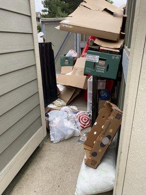 one of many dumpsters filled with trash, food, feces, etc.