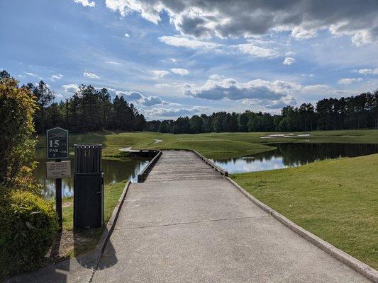 Approaching the famous 15th hole bridge between the blue and white tees. So much history and prestige here.