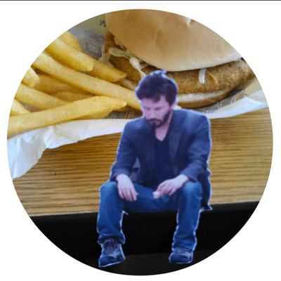 Don't be fooled by his glum appearance, Sad Keanu loves the country chicken sandwich combo.