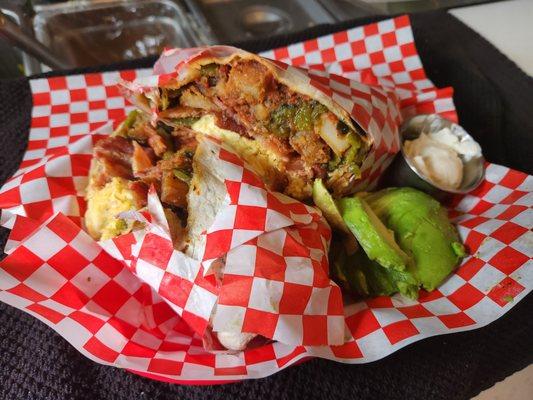 Breakfast Burrito - Three Eggs, Home Fries, Bacon, Roasted Poblano Peppers, Pepper Jack Cheese, Avocado, Salsa & Sour Cream