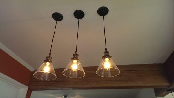 Pendant lights over the dining table.