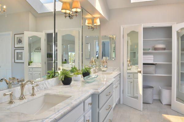 With the clothes closet relocated & the mirror sliding doors replaced with ones that compliment the vanity, it now serves as a linen closet!