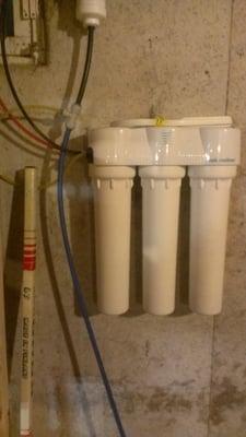 A 3 stage Microline Reverse Osmosis System mounted in the basement connected to the Fridge and kitchen faucet...