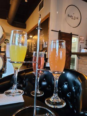 Mimosa flight with orange, grapefruit, and cranberry juice