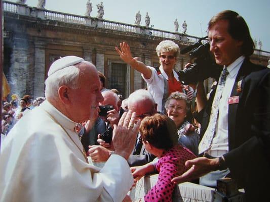 Receiving a blessing from Pope John Paul when filming a public audience.