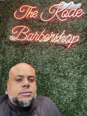 Bald shave with beard trim by Reggie the barber