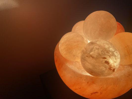 Experience the warm glow of our Himalayan salt stones, adding a soothing touch to the spa's peaceful environment.