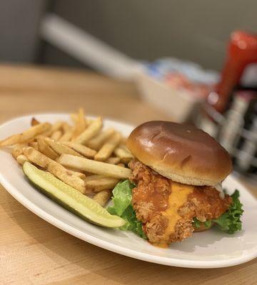 Buffalo chicken sandwich -  piled high with swiss cheese, lettuce, tomato and a special sauce.