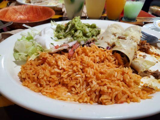 Triple chicken enchiladas, rice, guacamole, Pico and sour cream