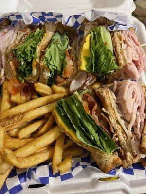 Club sandwich with fries