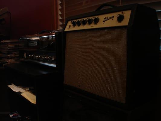 A fully-restored 1960's Gibson Skylark tube combo sitting right next to a modern Line 6 head that uses digital modeling tech.