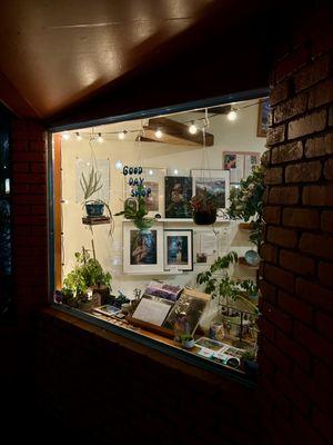 Looking in one of the shop windows at night