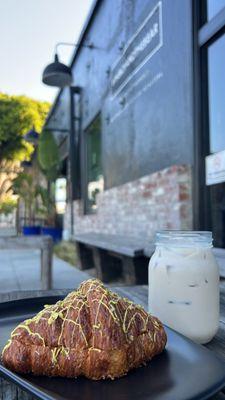 Pistachio croissant and iced chai latte