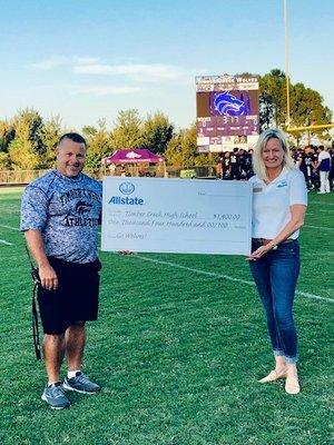 Check presentation to Timber Creek High School