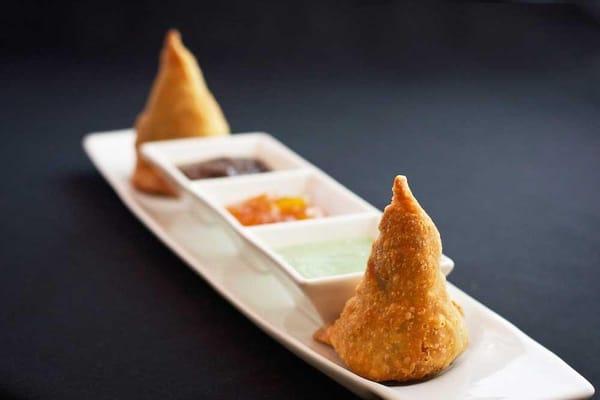 Vegetable Samosa...Crispy flour pastry with potato and peas filling.