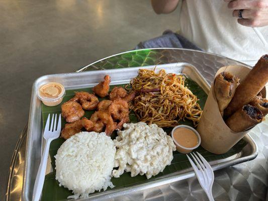 Lumpia, chow mein, macaroni salad, steamed rice, tempura shrimp