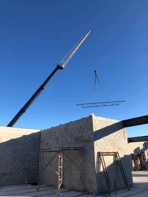 Bar joist being set with the jib on.