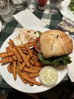 Breaded fish sandwich with coleslaw, sweet potato fries and tarter sauce.