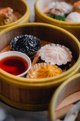 Squid ink black truffle xlb, regular xlb, and crab roe turmeric xlb