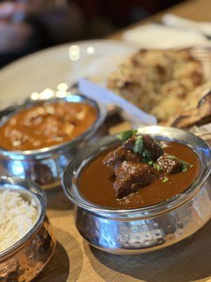 Goat curry, and butter chicken (behind).