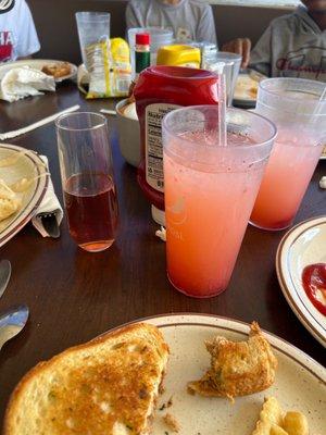 Home made strawberry lemonade and black cherry mimosa... by the way they have a ton of flavored mimosas.