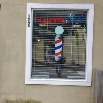 The window of the entrance of Square cutz.