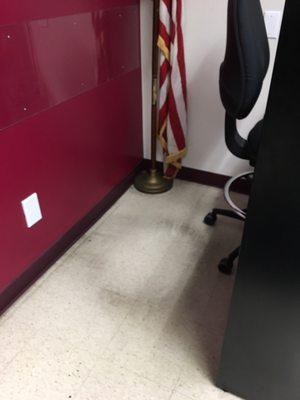 I was sent away because of "federal law," but look at this flag dragging on the floor behind the vacant guard's desk