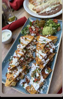 Pastor quesadillas and fajita enchiladas with queso