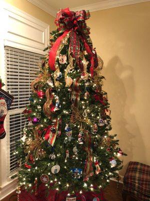 Xmas Tree with beautiful topper and ribbon sashes from Charlene's!