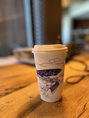 Mystery drink in soy ink, compostable, cafe branded cup