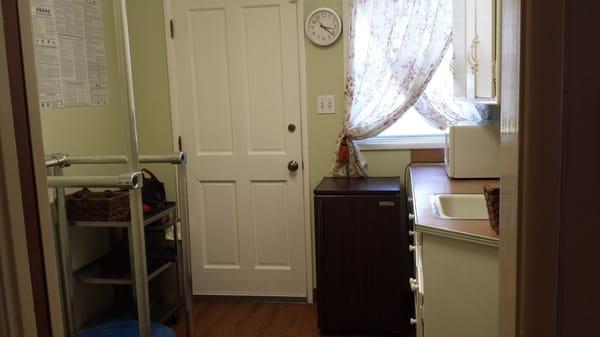 Charming kitchenette doubles as a treatment room.