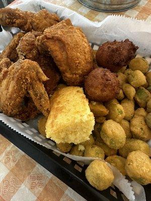 Fried Chicken (4 pieces) and hush puppies with fried okra, corn bread.