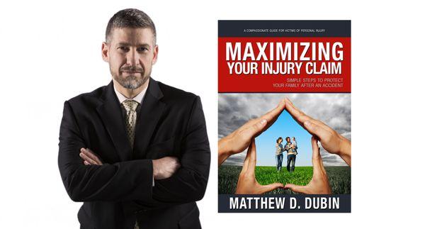 Founding Attorney Matt Dubin with his bestselling book "Maximizing Your Injury Claim".