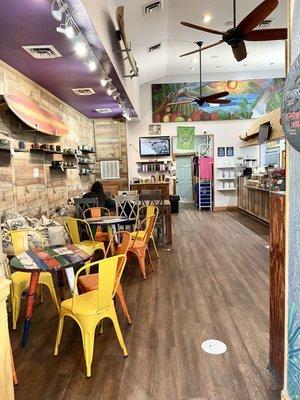 Inside of shop - charming beachy decor - sit + stay awhile. There's a small outside (shaded) coffee garden with seating out back