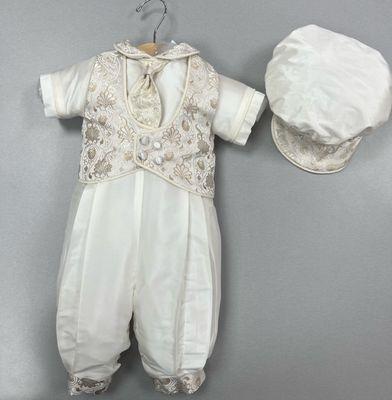 An adorable white silk christening suit with gold brocaded vest and matching Conductor cap