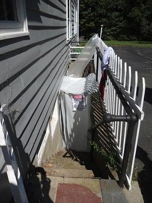 A decontamination chamber at base of stairs.