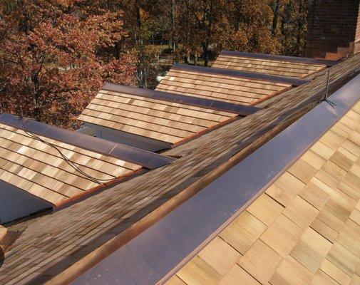 Cedar roof installed with copper valleys and hips