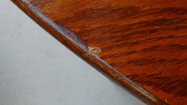 Damage to top of dining room table caused by DisasterLink / Pelican